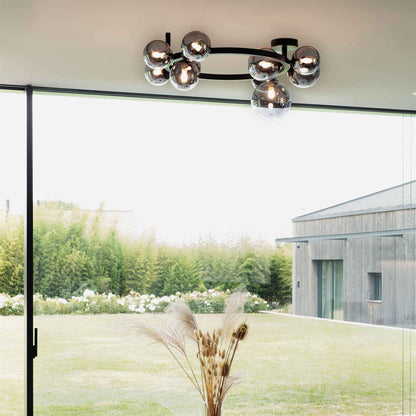 Plafonnier PERLAGE PL10 noire diffuseurs fumé - Luminosité élégante avec 10 sphères en pyrex fumé. Structure métal noir époxy robuste.